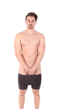 Young man with urological problems on white background