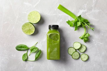 Photo sur Aluminium Jus Flat lay composition with bottle of delicious detox juice and ingredients on light background