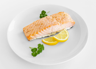 Cooked salmon with lemon and parsley