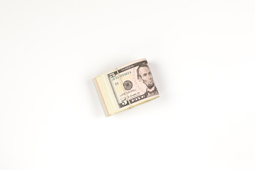 Stack of USA 5 dollars isolated on white background.