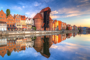 Fototapeta na wymiar Beautiful old town of Gdansk reflected in Motlawa river at sunrise, Poland.