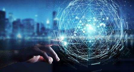 Businessman using digital triangle exploding sphere hologram 3D rendering