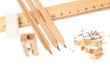 Pencil ruler sharpener and eraser isolated over white background
