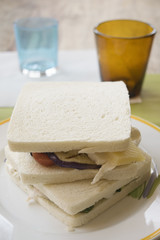 sandwiches with filling of ham and cheese