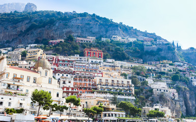 View of Positano town at Amalfi coastline. Colorful houses along the sea coast, Italy