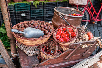 Rome, market detail in Campo de Fiori (fields of flower), chestnuts, hot peppers in wicker basket