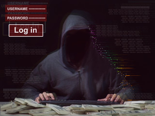 Cyber attack with unrecognizable hooded hacker.Man in hoodie is hacker. Computer security concept