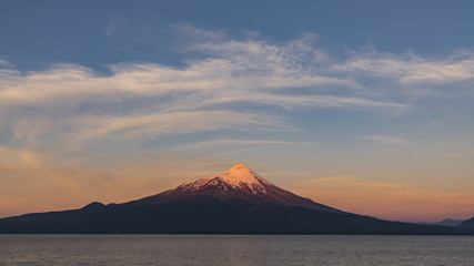 Beautiful sunset at a viewpoint in Ensenada located opposite the Osorno volcano, Puerto Varas, southern Chile