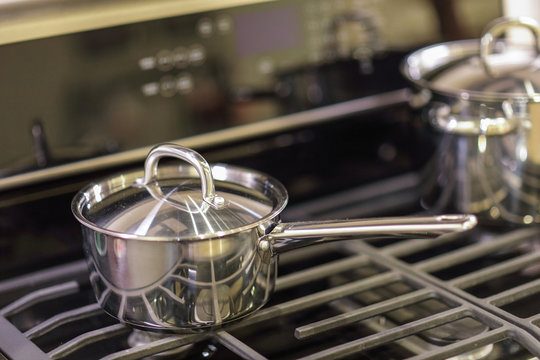 Stainless steel pot on a gas burning stove