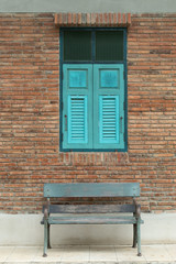 Fototapeta na wymiar Striped brick walls and wooden window is used as the background.