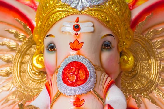 God Ganesha colorful elephant statue to celebrate Hindu Festival Ganesha Chaturthi in India. The Om symbol on the face