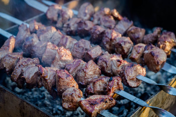 Shashlik pork on skewers on the chargrill closeup