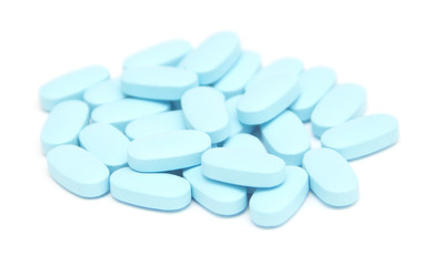 Obraz na płótnie Canvas blue pills, capsules, tablets on white