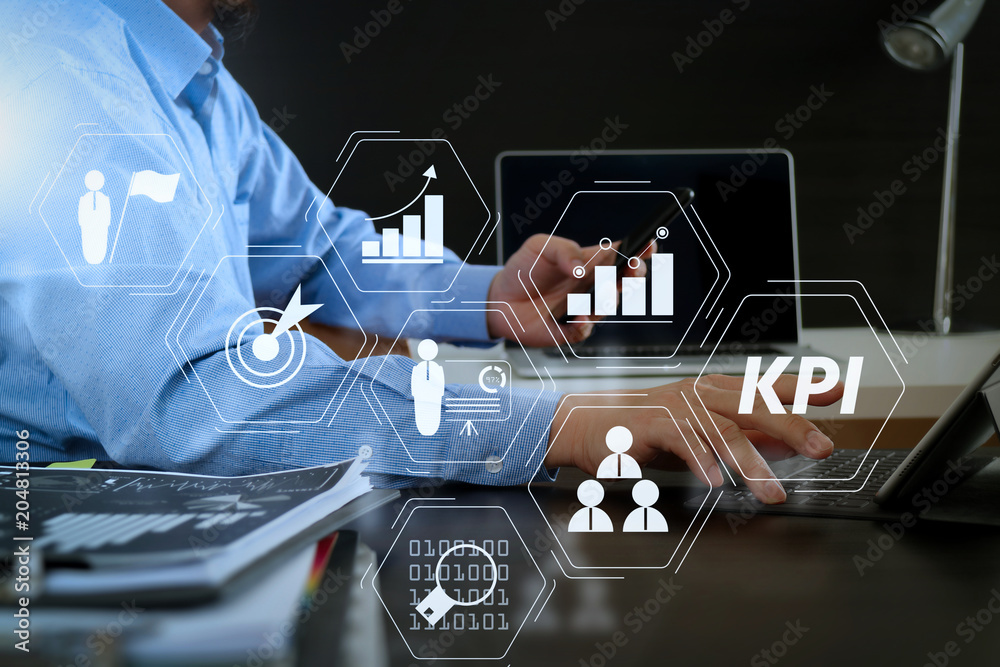 Poster businessman working with smart phone and digital tablet and laptop computer in modern office