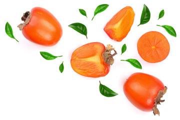 persimmon decorated with leaves isolated on white background with copy space for your text. Top view. Flat lay pattern