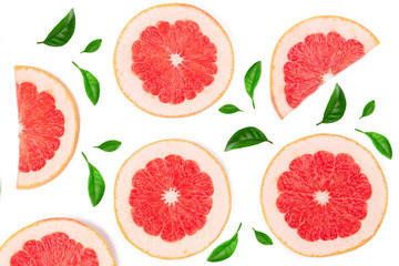 Grapefruit slices decorated with green leaves isolated on white background. Top view. Flat lay pattern