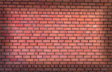 Detailed red brick wall with vignette. Copy space.