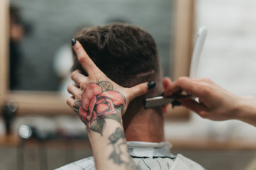Fototapeta na wymiar Dangerous razors in barbershop