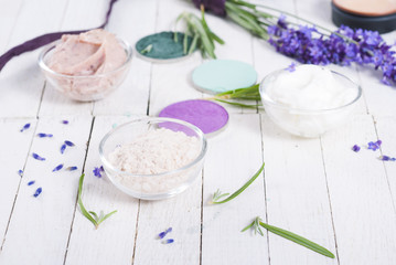 grooming products and fresh lavender bouquet on white wooden table background