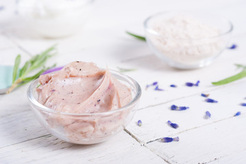 grooming products and fresh lavender bouquet on white wooden table background