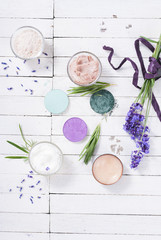 grooming products and fresh lavender bouquet on white wooden table background