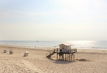 Fototapeta na wymiar life guard tower on Westerland beach on a sunny evening