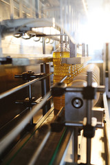 Sunflower oil production plant. The line of bottling of vegetable oil in plastic bottles.