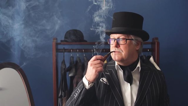 Portrait of posh mature gentleman visiting a tailor's shop. Slow motion