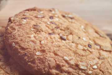 Vegan crunchy cookies with sunflower, flax seeds and sesame seeds isolated. Macro view