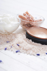 cosmetic creams and lavender on white wood table background