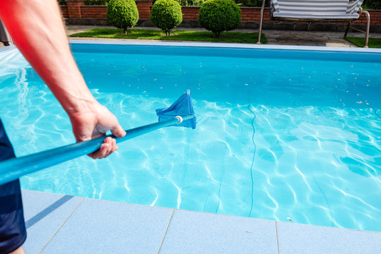 Male hand hold pool net cleaner