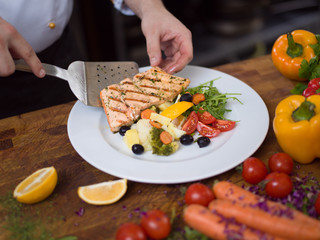 cook chef decorating garnishing prepared meal