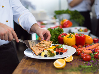 cook chef decorating garnishing prepared meal