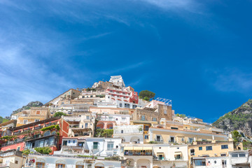 Obraz premium Positano Amalfi Coast Neaples Italy - Abstract view of colored houses and windy clouds.