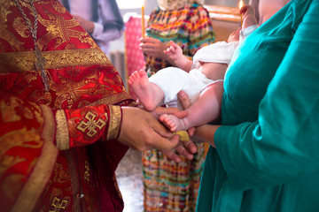Fototapeta premium The ceremony of christening the little boy at church