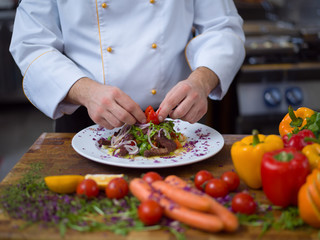 cook chef decorating garnishing prepared meal