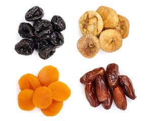 Set of dried fruits isolated on white background. Top view. Flat lay