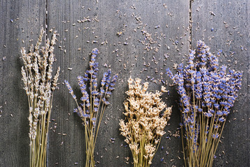 Dried lavender bunch variation on black wooden table background