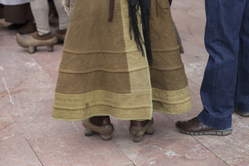 Woman wearing traditional costume and madreñas