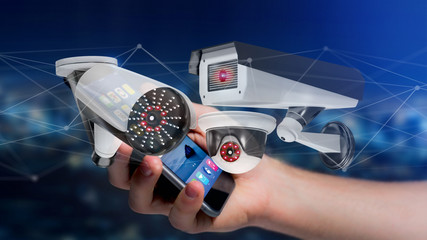 Businessman using a smartphone with a Security camera system and network connection - 3d rendering