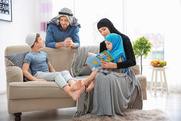 Happy Muslim family spending time together at home