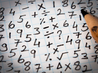 symbols and figures written in pencil in the mathematics book