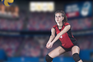 Female professional volleyball player on volleyball court