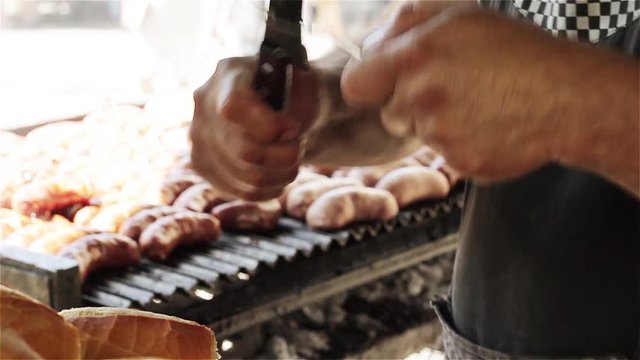 Man Sharpening Knife at Choripan Stall, Buenos Aires Street Market - Close Up