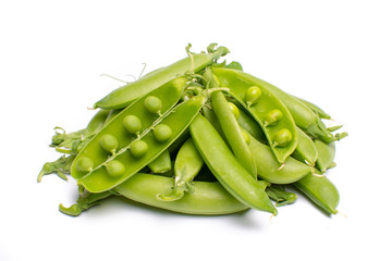 Pile of fresh green ripe sugar snaps, sweet peas copy space close up isolated on white background