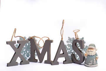 Gray wooden decorative letters X M A S with snowflakes copy space isolated white background, Christmas holidays postcard concept