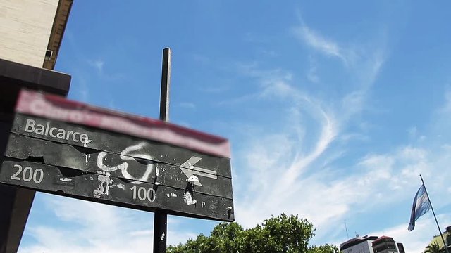 Street Sign and Argentine Flag in Buenos Aires (Argentina). Balcarce Street. Zoom In.