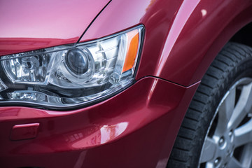 close up view of shiny red car background