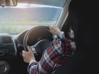 Woman driving car.