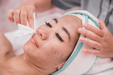 Obraz na płótnie Canvas woman facial care in beauty salon and spa